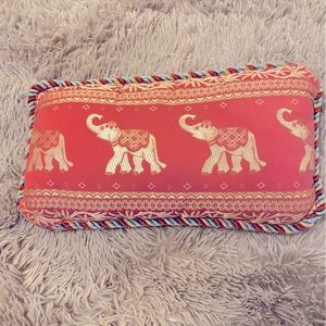 Vibrant orange silk cushion. Gold elephant pattern. Edging accent. Poly-fill.
